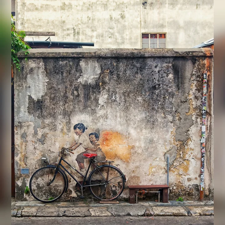 Penang Street Art - Kids on bicycle by Ernest Zacharevic